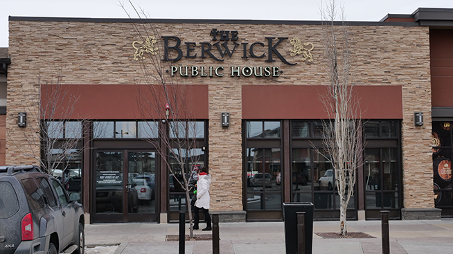 The Berwick Public House sign on the exterior of their building.