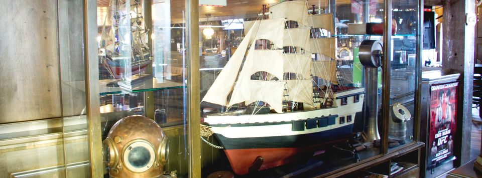 A model ship in a glass case at Dixon's Pub in Midnapore.