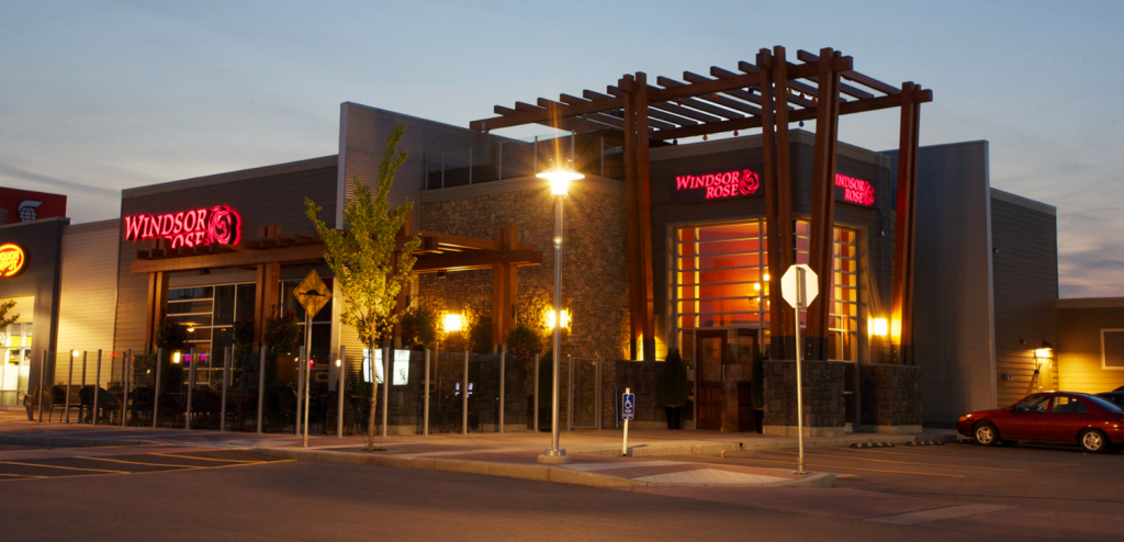 The exterior of the Windsor Rose pub and parking spaces. 