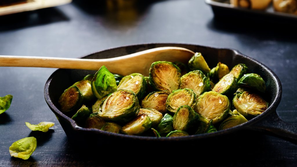 roasted brussels sprouts in a cast iron dish