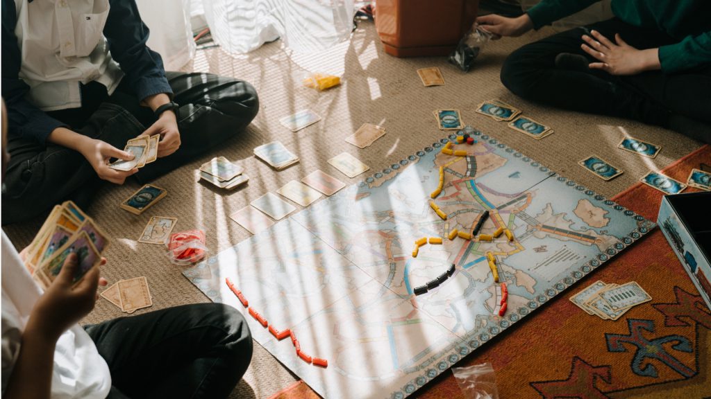 kids playing a board game on the floor