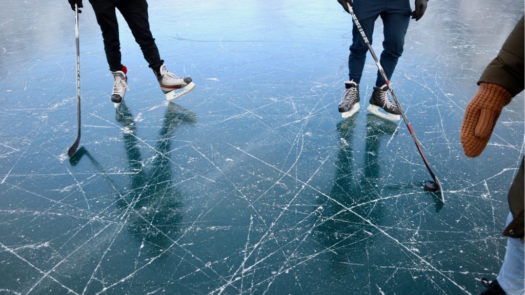 kids playing hockey on the ice