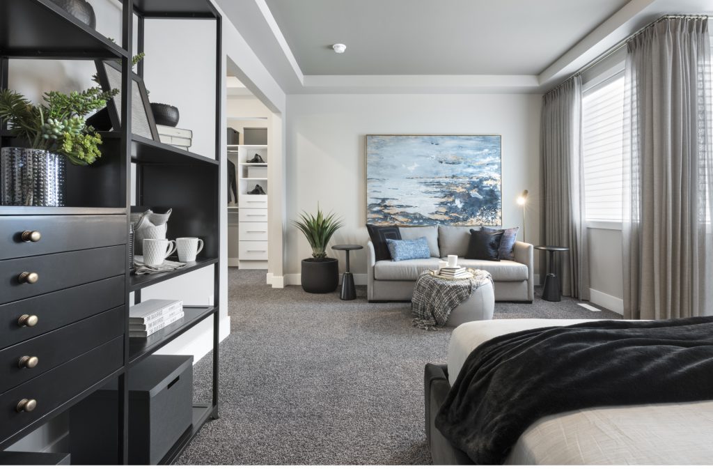 jayman built master ensuite with bed, shelving, and sitting area