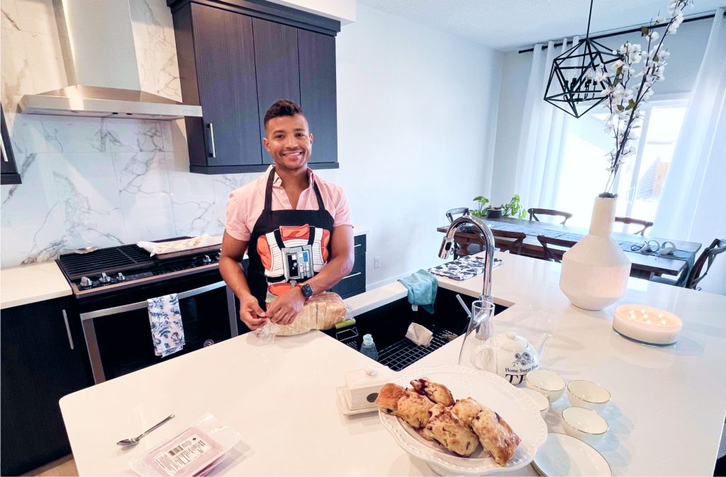 person standing in their new jayman built kitchen