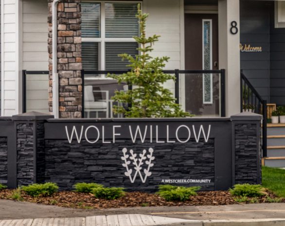 new wolf willow sign at the entrance to the community