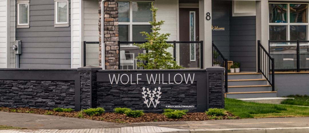 new wolf willow sign at the entrance to the community